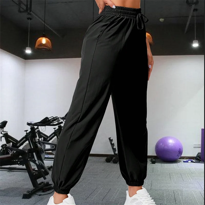 Loose running and fitness pants, women's side pockets, outdoor casual sports pants, ankle tied yoga pants